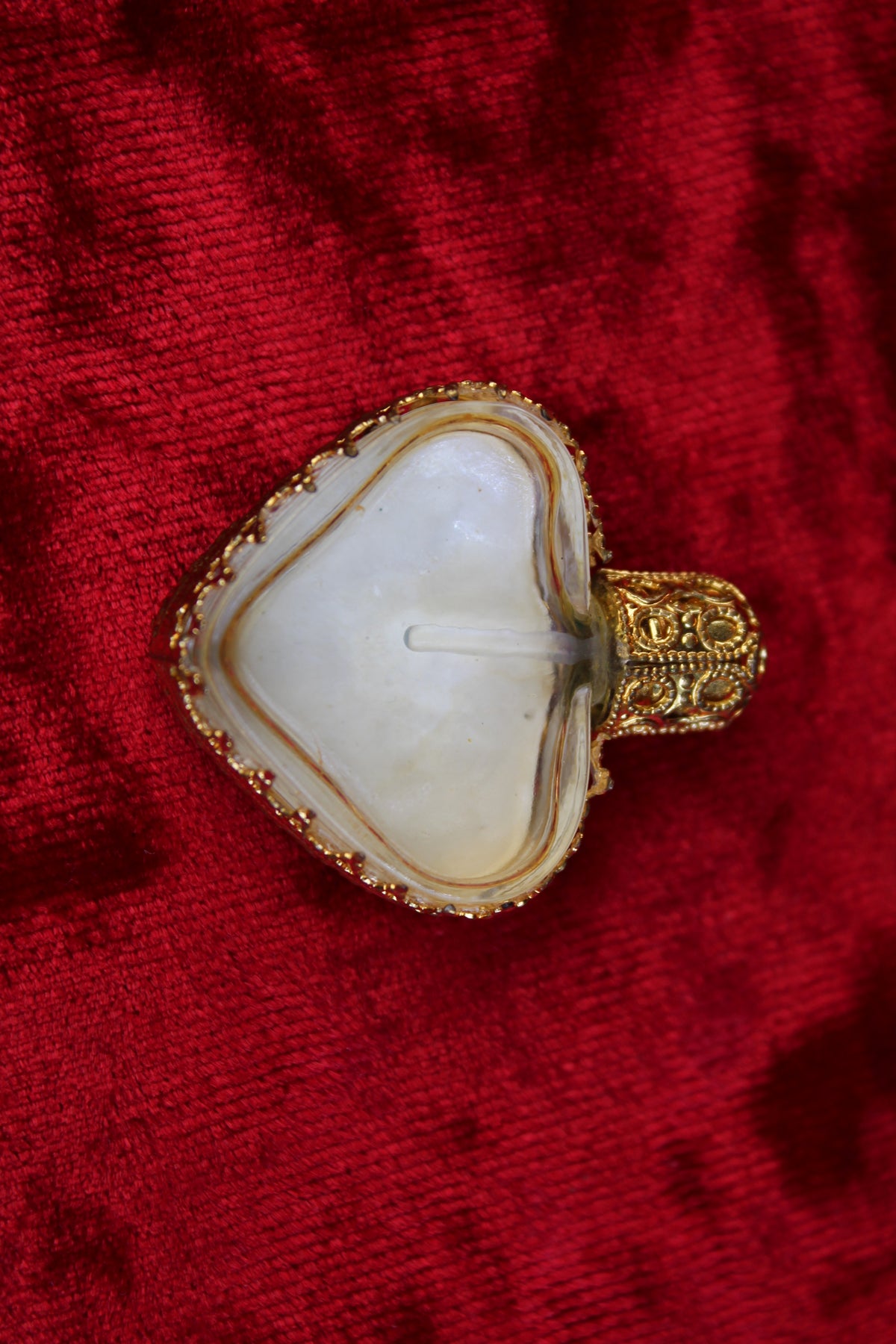 Rare Austrian heart-shaped perfume bottle with gold filigree and petit point rose embroidery.