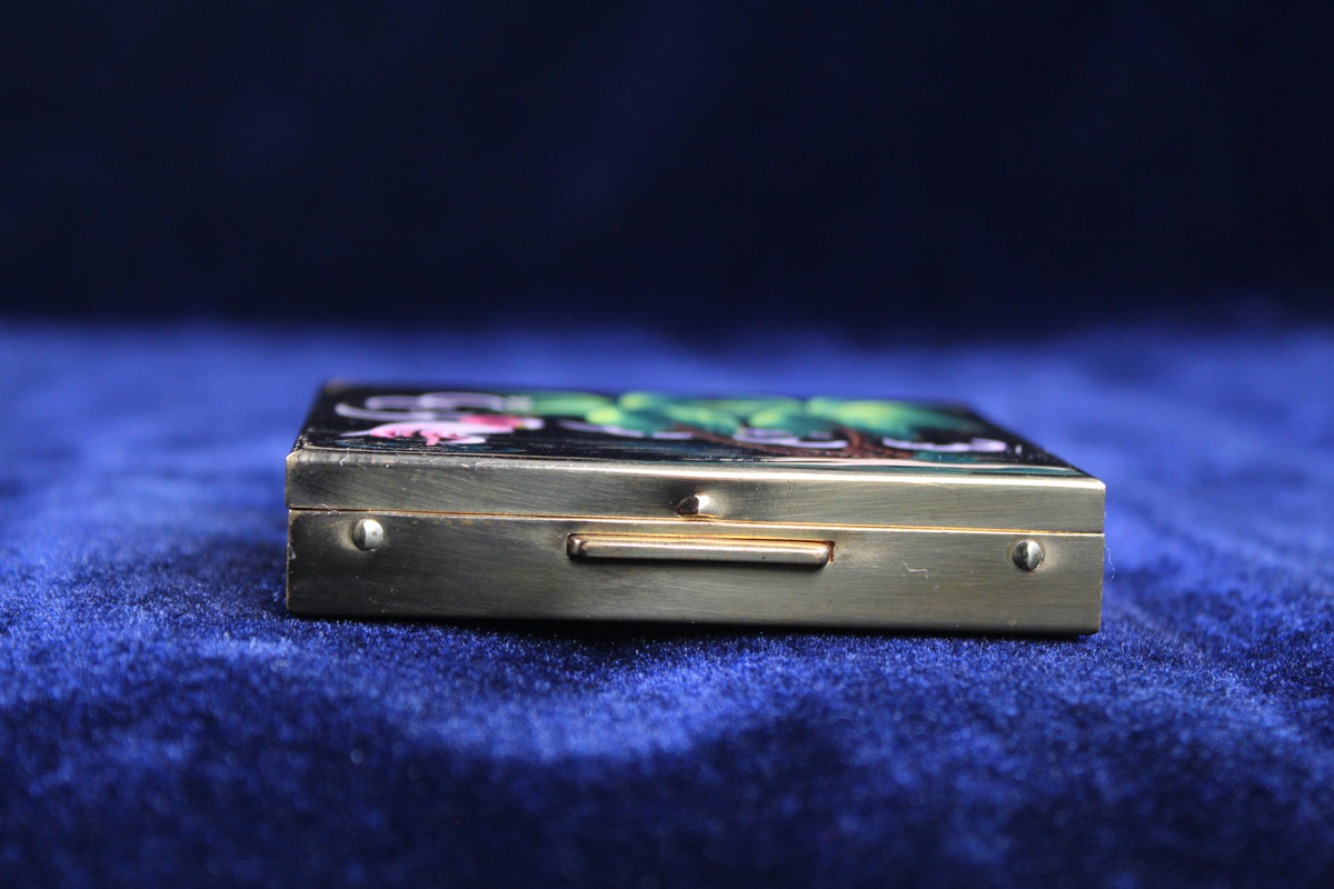 Gold-toned powder compact with hand-painted flamingo and palm tree scene.