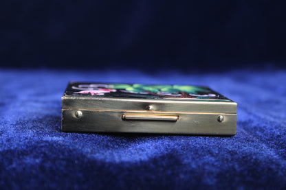 Gold-toned powder compact with hand-painted flamingo and palm tree scene.