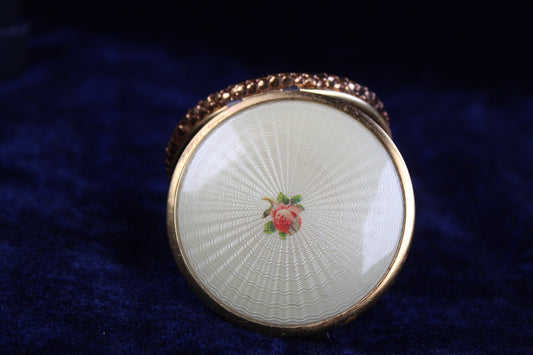 1930s-1940s gold tone compact with guilloché enamel lid featuring a rose motif.