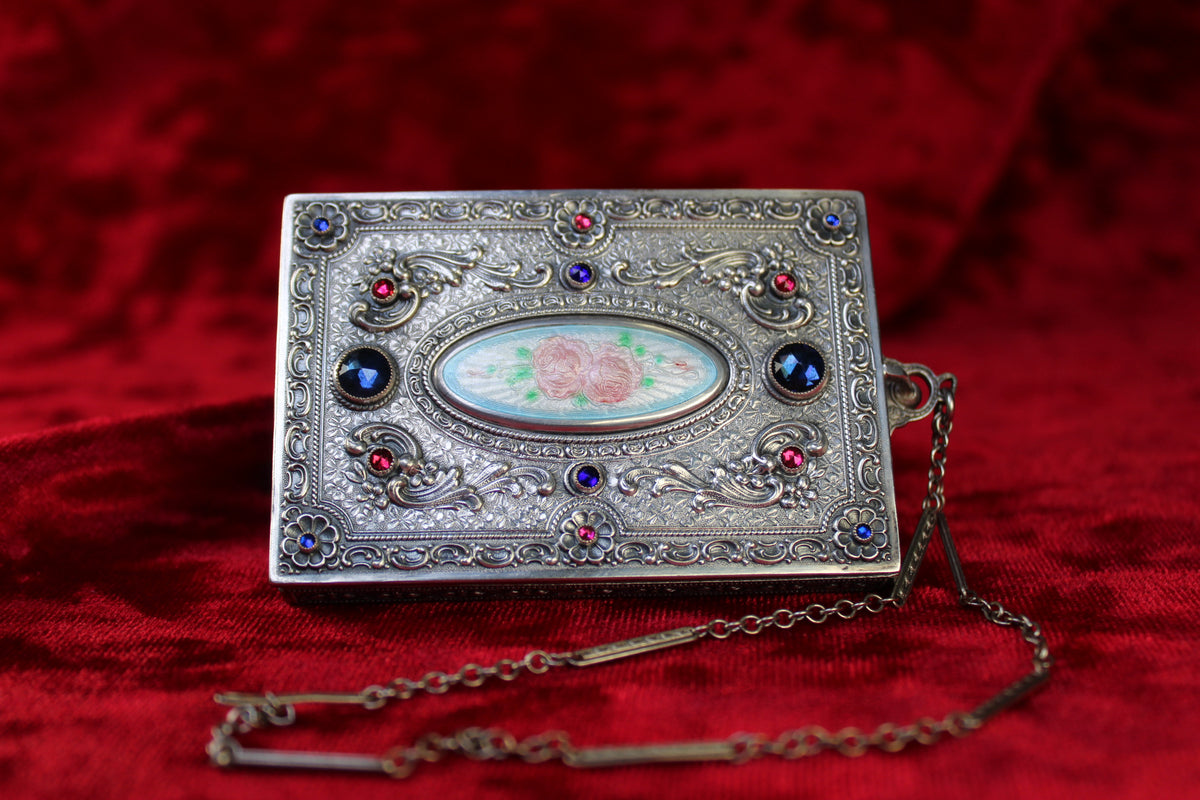 Antique French sterling silver compact with guilloché enamel rose panel and jeweled accents.