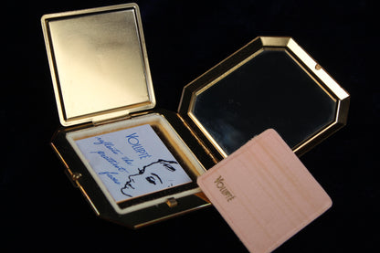 1950s Volupte octagonal gold-tone compact with mirror, powder puff, and insert card.