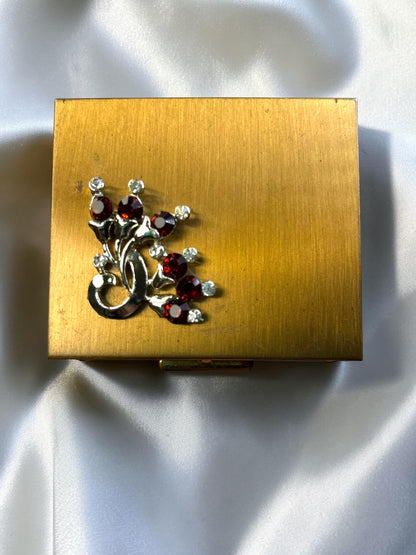 S.F. Co. Fifth Avenue gold-tone powder compact with ruby red and clear rhinestones, circa 1950s.