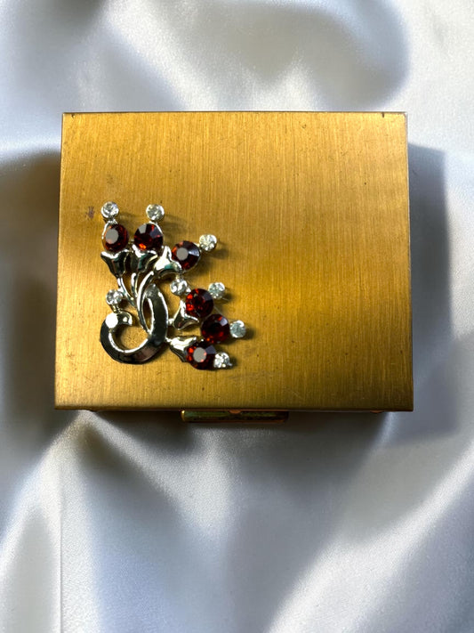 S.F. Co. Fifth Avenue gold-tone powder compact with ruby red and clear rhinestones, circa 1950s.