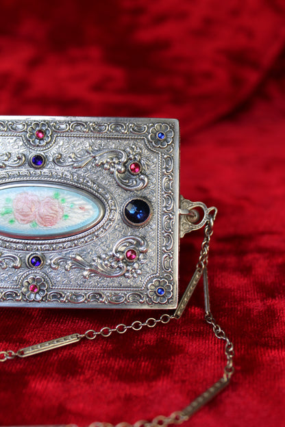 Antique French sterling silver compact with guilloché enamel rose panel and jeweled accents.
