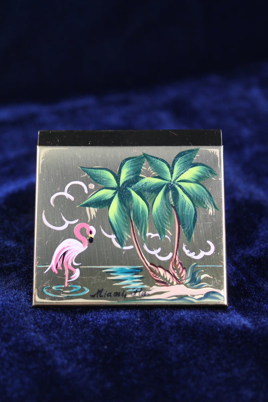 1950s Miami powder compact with hand-painted flamingo, palm trees, and "Miami, Fla."