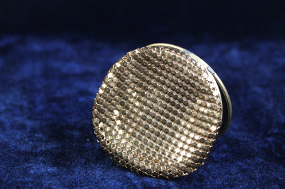 1930s-1940s gold tone mesh compact with guilloché enamel and rose motif.