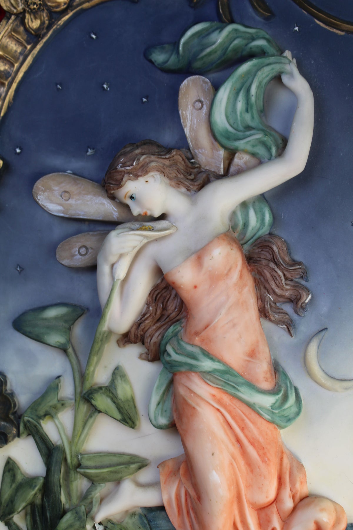 Vintage night fairy wall plaque with ornate gold frame, holding a flower against a starry sky.