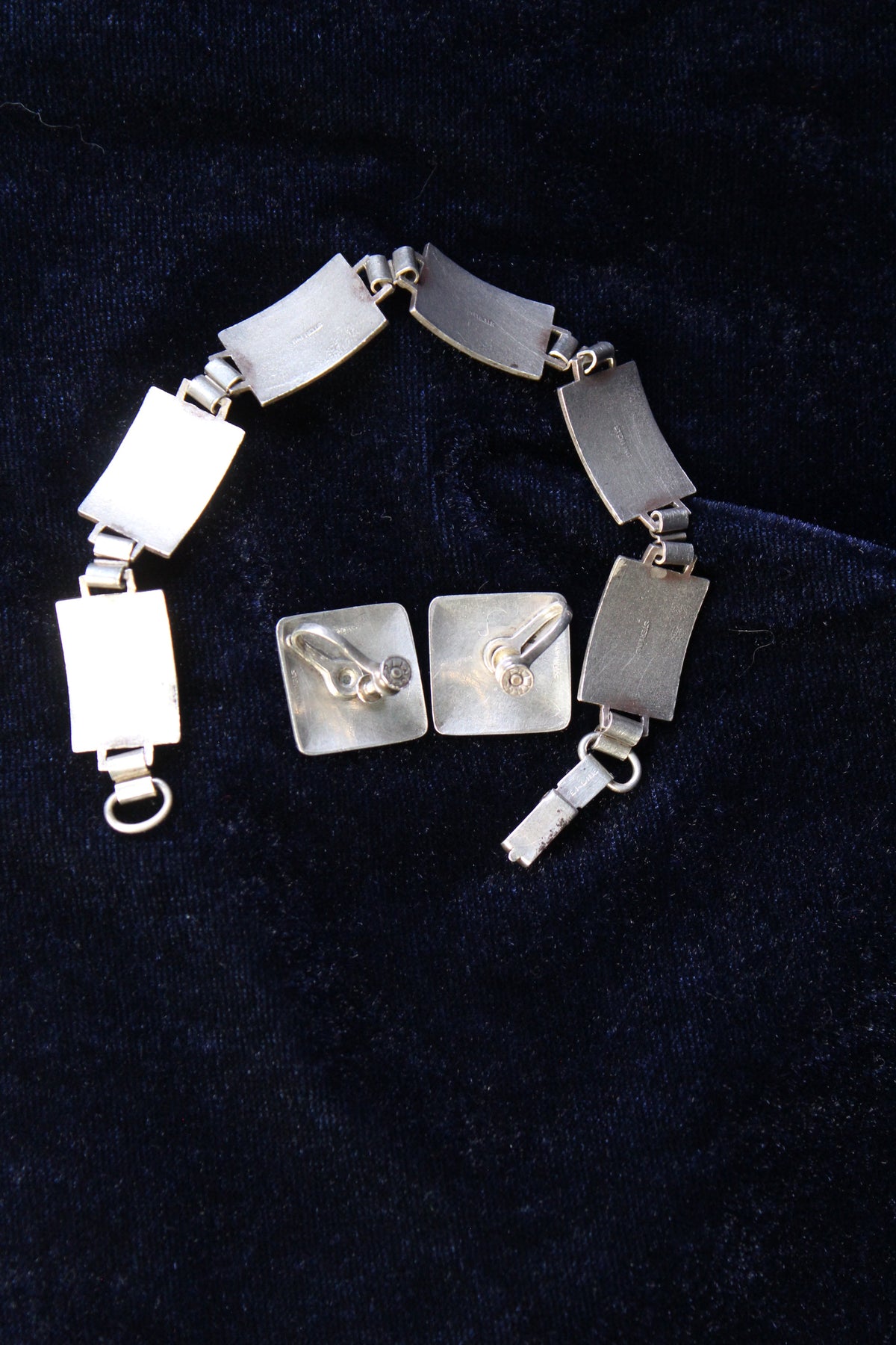 Sterling silver bracelet and square earrings with guilloché enamel rose design.