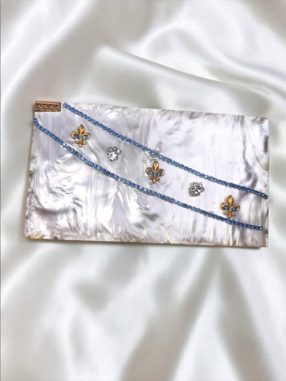 1940s Volupte carryall compact purse with marbled lucite, blue rhinestones, and gold fleur-de-lis.