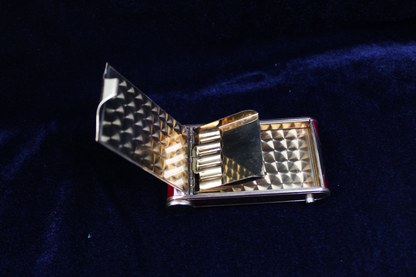 1940s German novelty camera compact with tortoiseshell cigarette holder, open.