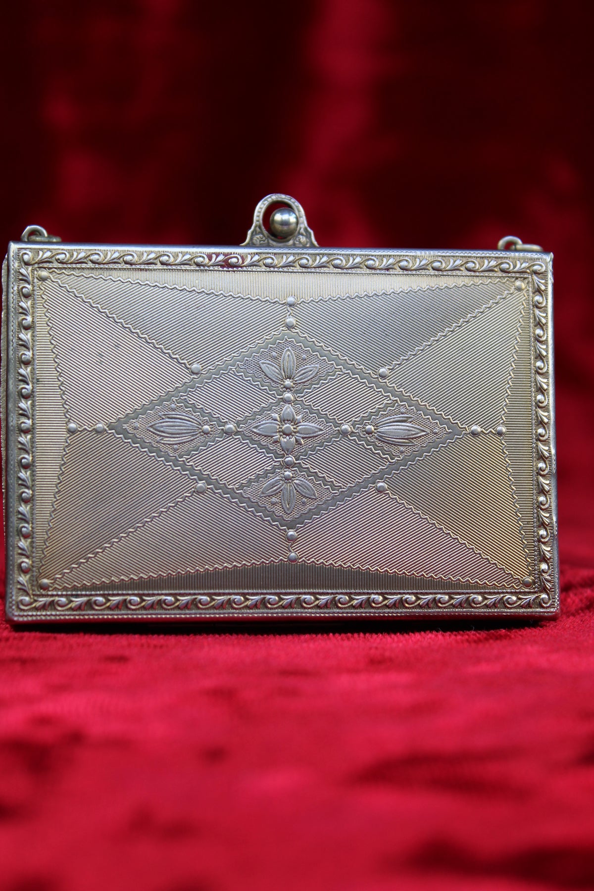 Antique French vanity case with guilloché detailing and ornate metalwork.