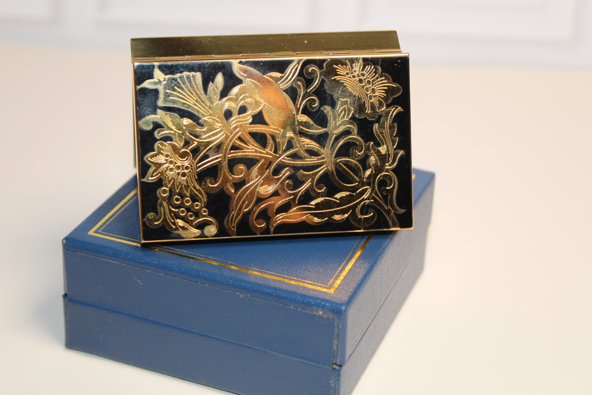 Jaestial Vintage Musical Compact with gold floral enamel on a blue box.