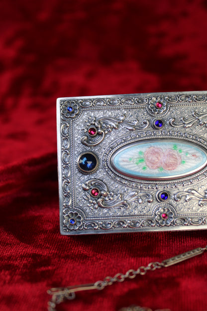 Antique French sterling silver compact with guilloché enamel rose panel and jeweled accents.
