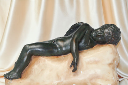 Jaestial Vintage "The Sleeping Angel" sculpture of a reclining nude figure on a pale base.