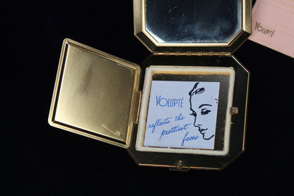 1950s Volupte octagonal gold-tone compact with rhinestone clasp and original insert.