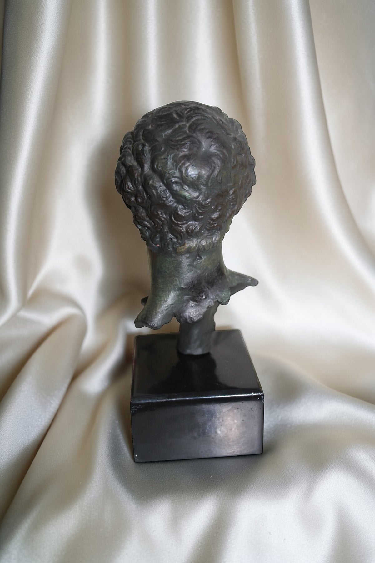 Jaestial Vintage Roman Bust Sculpture with dark patina on a black square base.