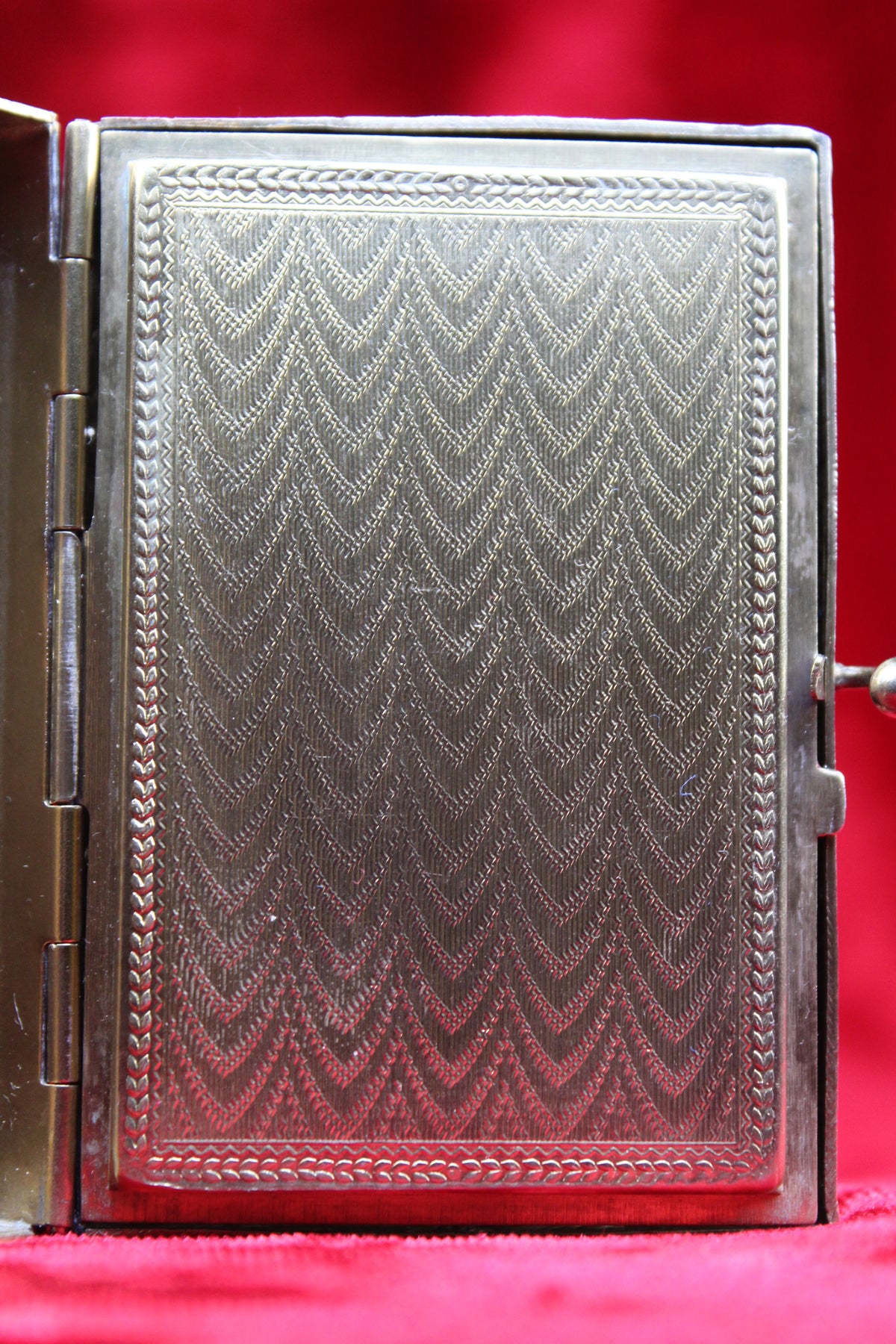 Antique French vanity case with intricate guilloché pattern and ornate metalwork.