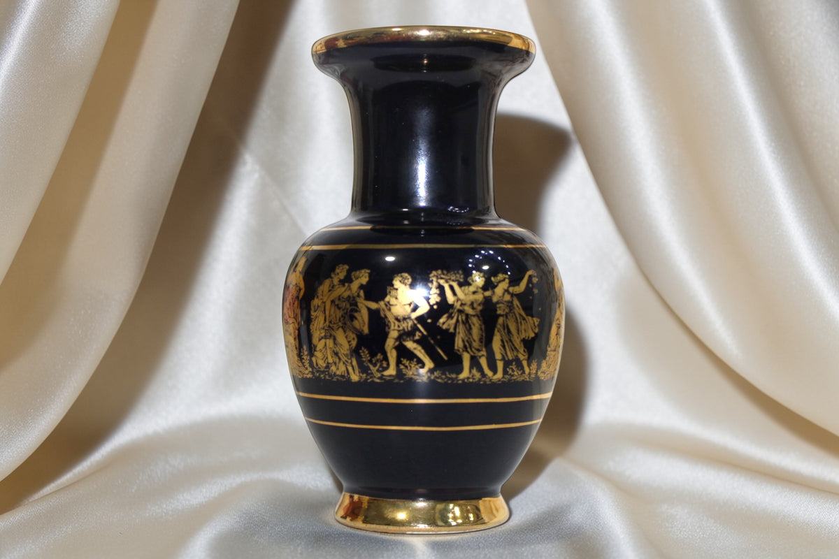 Black and gold miniature vase with Grecian procession motif, 5 inches tall.