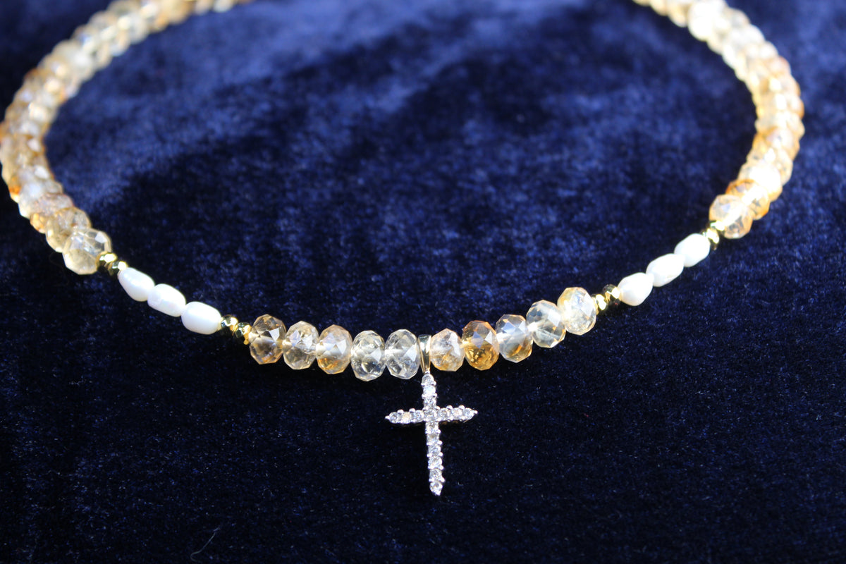 10K gold necklace with faceted citrine, freshwater pearls, and a pavé cross pendant.