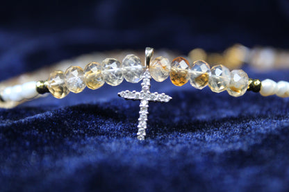10K gold necklace with citrine beads, freshwater pearls, and a pavé cross pendant.