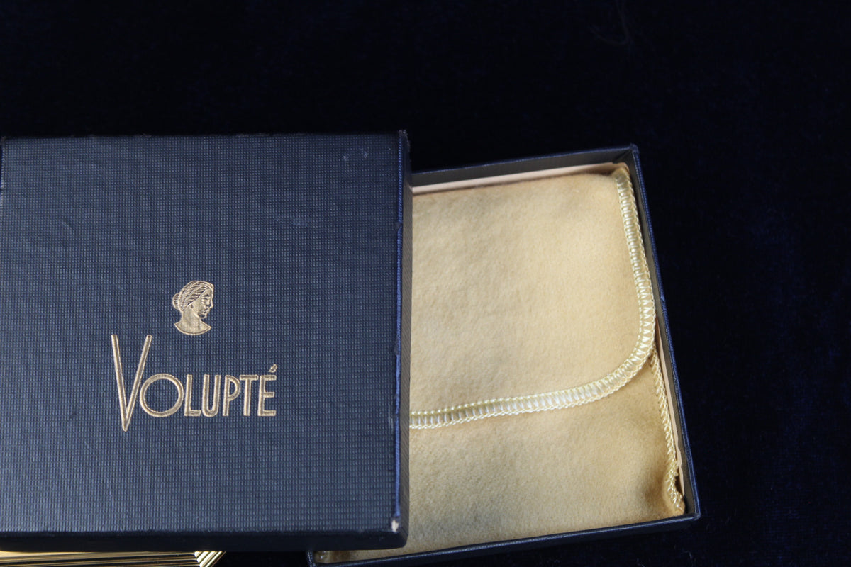 1950s Volupte compact in its original blue box with gold logo and a velvet pouch inside.
