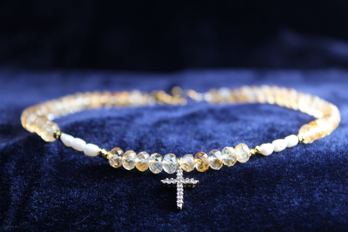10K gold necklace with citrine gemstones, freshwater pearls, and a pavé cross pendant.