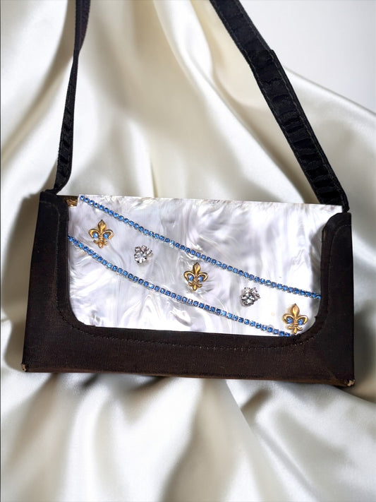 1940s Volupte carryall compact purse with marbled lucite, blue rhinestones, gold fleur-de-lis, and black fabric.