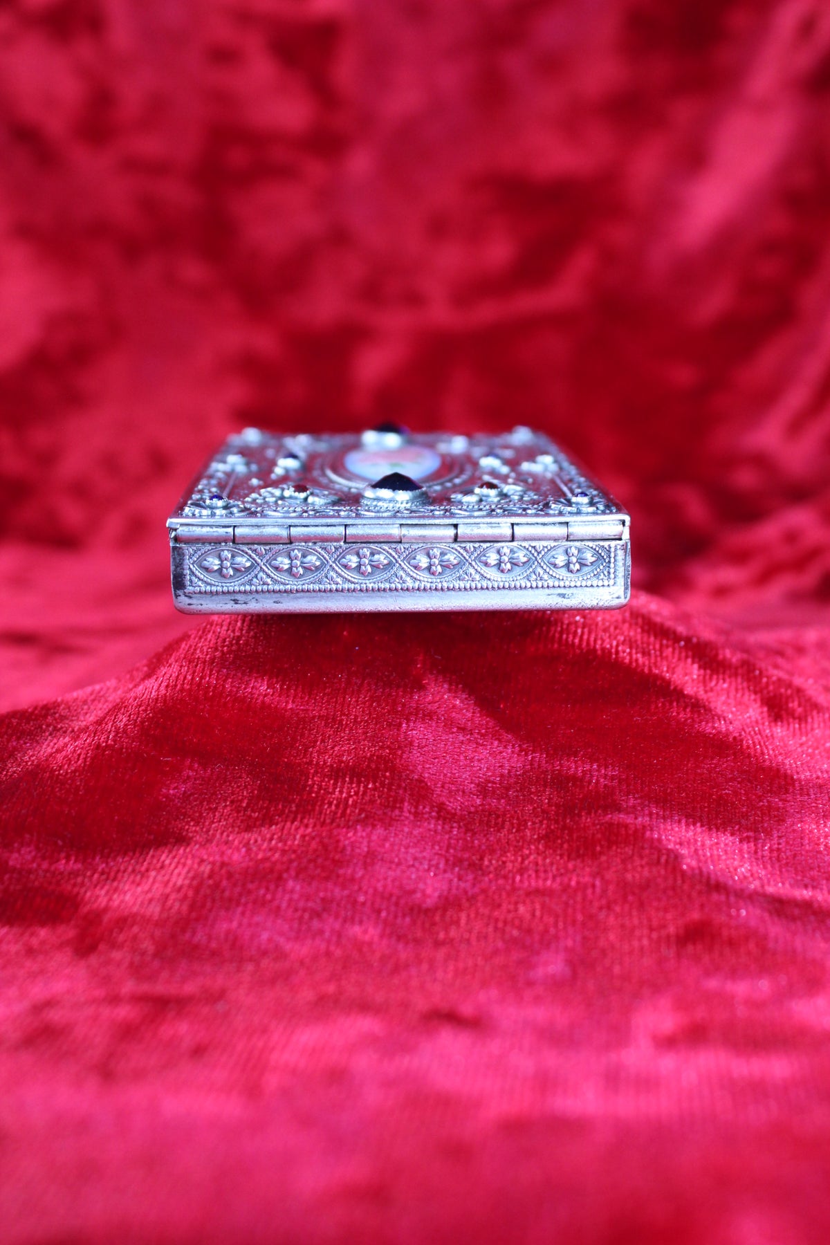 Antique French sterling silver compact with guilloché enamel rose and jewel accents.
