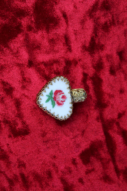 Rare Austrian heart-shaped perfume bottle with gold filigree and petit point rose embroidery.