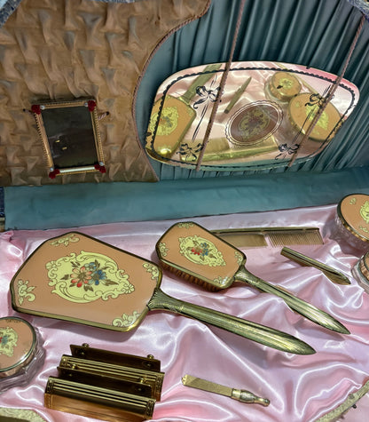 1940s vanity set with hand-painted floral designs in a shell-shaped case.
