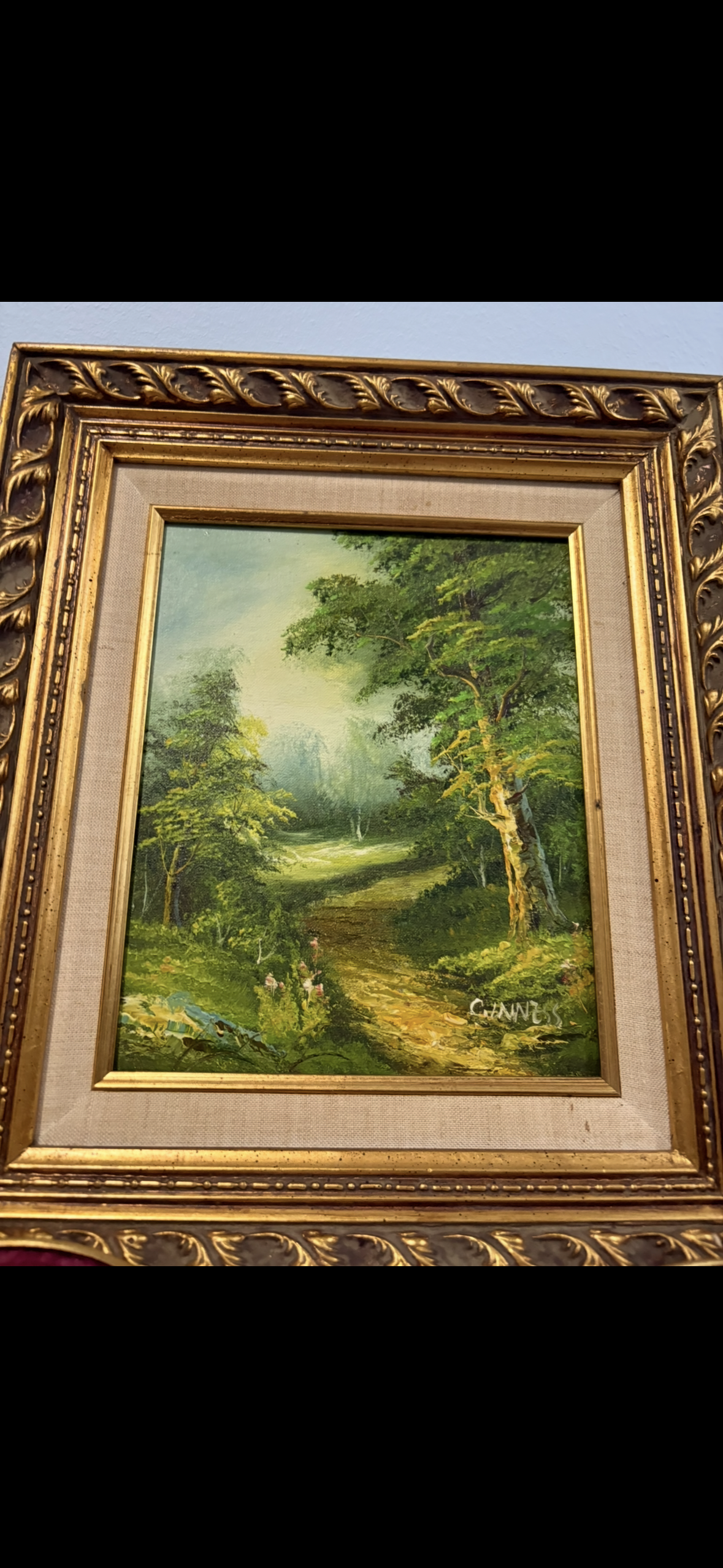 Vintage forest landscape oil painting with gilded baroque frame.