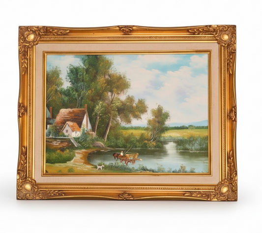 Vintage oil painting of a countryside river scene with a cottage and ornate gold frame.