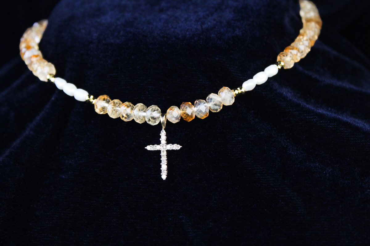 10K gold necklace with citrine, freshwater pearls, and a diamond cross pendant.