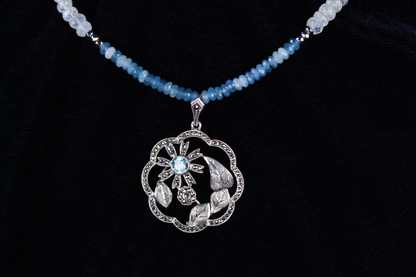 Sterling silver pendant necklace with aquamarine and moonstone beads.
