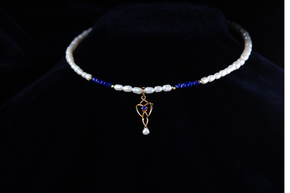 10K gold lavalier necklace with lapis lazuli beads and freshwater pearls, featuring a vintage pendant.