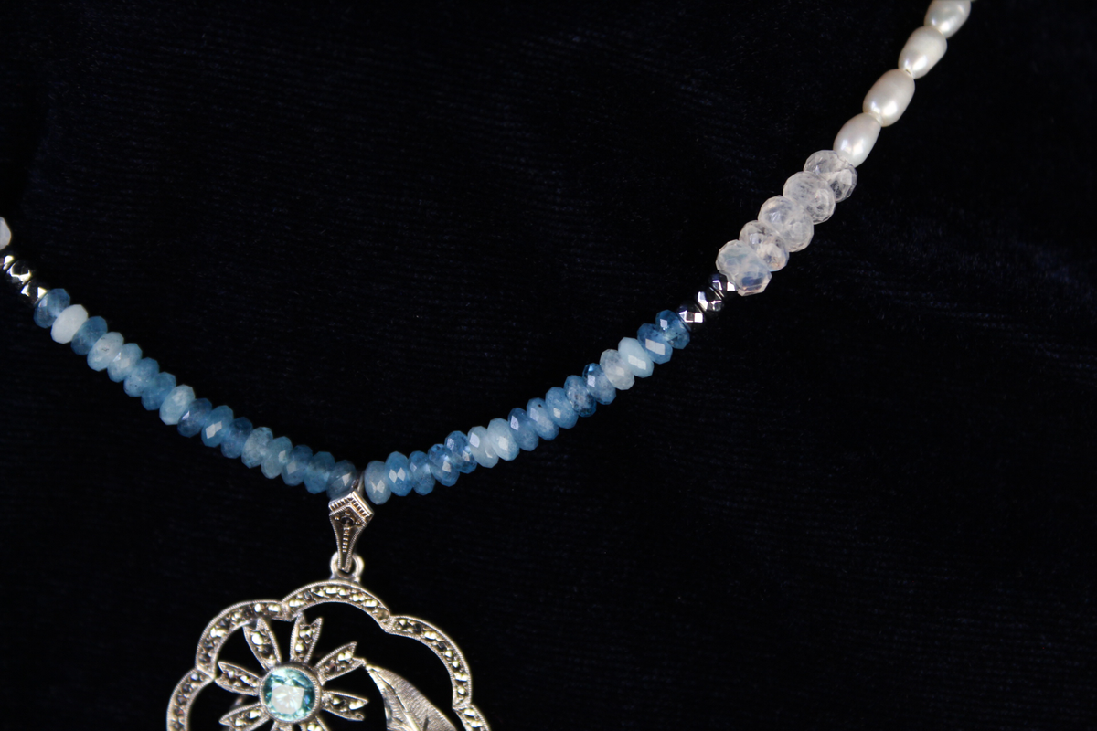 Sterling silver pendant necklace with aquamarine and moonstone beads.